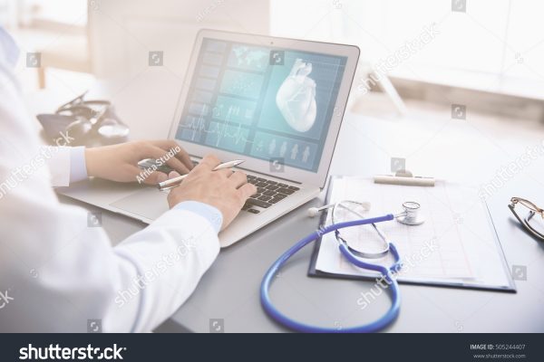 stock-photo-cardiologist-working-with-laptop-at-office-health-care-concept-505244407