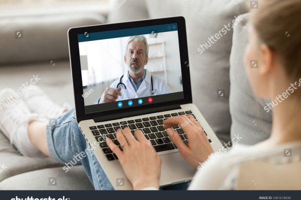 stock-photo-young-woman-sit-on-couch-at-home-have-video-call-with-doctor-use-wireless-internet-connection-on-1681618696